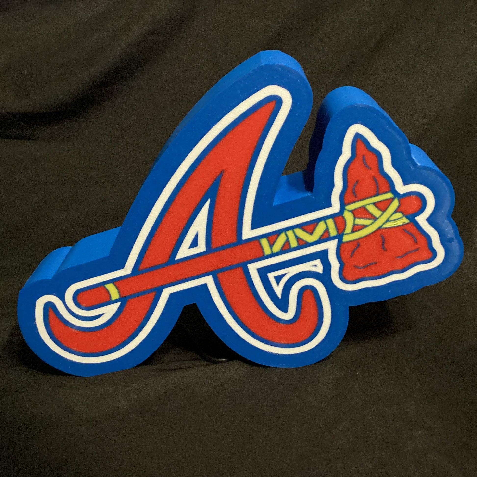 Atlanta Braves logo on a dark background